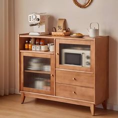 a wooden cabinet with glass doors and drawers