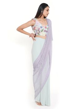 Sea foam georgette embroidered choli and saree with purple mesh pallu. Disclaimer: Since we are a made-to-measure brand and our dyeing process and embroidery are handcrafted, there may be slight variations in the color and embroidery of the actual product. The print placement may also vary from what is represented in the images shown on the product page. Floor-length Pre-draped Saree With Floral Embroidery, Bollywood Style Floor-length Pre-draped Saree With Floral Embroidery, Bollywood Style Floral Embroidery Pre-draped Saree, Fitted Net Pre-draped Saree For Reception, Embroidered Purple Georgette Pre-draped Saree, Purple Floral Embroidered Saree For Reception, Purple Floral Embroidery Saree For Reception, Purple Saree With Floral Embroidery, Purple Floral Embroidered Semi-stitched Saree