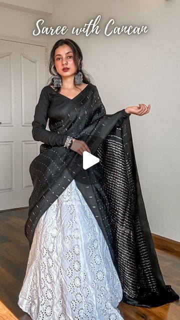 𝐀𝐫𝐜𝐡𝐞𝐞 | Saree Drapes on Instagram: "Save and send this Saree on Lehenga tutorial to a saree lover 🖤

Draped a pure silk saree in mulberry with tanchoi weave on deep black body topped with sterling silver zari woven 1000 butas and a classy double border.

Created a unique saree draped or unique saree styling tutorial for saree beginners. Paired it with a cancan and a long flared skirt. Added oxidised jewellery to complete the look.

How to wear a saree on cancan-
🖤 Pick lightweight pure silk sarees fabric like Katan silk, mulberry silk, tussar silk, khaddi chiffon, khaddi georgette, gajji silk and assam silk.
🖤 Layer up your cancan as much as you want but make sure it’s easy to walk in.
🖤 You can drape the saree in half saree pattern or as a regular saree depending upon the fabri Styling Saree With Tops, Different Half Saree Draping Styles, Lehenga Drape Saree, Saree To Lehenga Draping, Double Drape Saree, Saree Draping In Lehenga Style, Half Saree With Saree, How To Wear Half Saree, Saree With Lehenga Drape