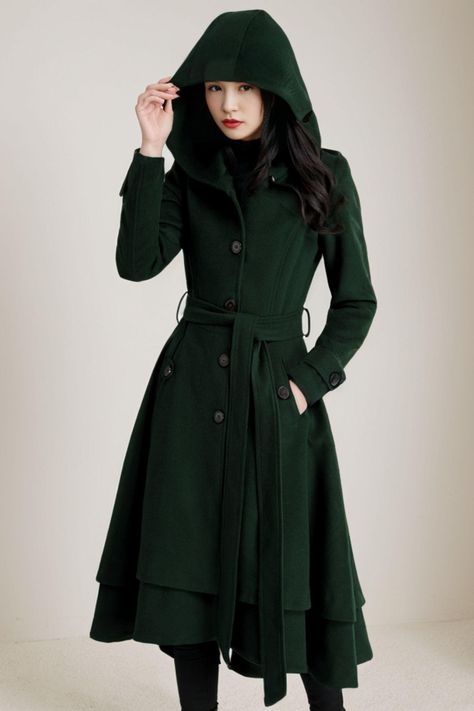 This wool women's hooded coat is made of high quality wool, durable and warm. It features an asymmetrical design to show off your sense of style. You will love and be able to wear this elegant coat over and over again. ★★ FEATURES 50% wool, 50% fiber, nylon Polyester lining Two side pockets Button closure Long sleeve wool coat A Line wool coat Hooded wool coat Belted wool coat Asymmetrical wool coat Perfect for winter, autumn Dry clean ★★Mode size Height 170cm (5′ 7″) Bust 84 cm (33") Waist 66 cm (26") She wears size XS. ★★ Custom order selecttion Request other color Request Change the Length Request Change the sleeve length Your height is not between 155cm- 175cm Your weight is not between 47kg -77kg ★★ Get your size in Size Chart with your body measurement https://www.etsy.com/listing/79 Dress Coats For Women Classy, Women’s Winter Coat, Green And Black Outfits, Cottagecore Winter Outfits, Womens Hooded Coat, Duffle Coat Women, Green Outfits For Women, Trench Coat Winter, Belted Wool Coat