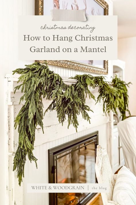 This is one Christmas decorating hack I wish I knew sooner! Learn the easy way to hang Christmas garlands on your fireplace (without damaging your mantel)! Hang Garland On Mantle, Hanging Christmas Garland, Garland On Mantle, How To Hang Garland On Mantel, Christmas Decorating Hacks, Garland Hanger, Christmas Garland Mantle, Hanging Christmas Stockings, Fresh Garlands