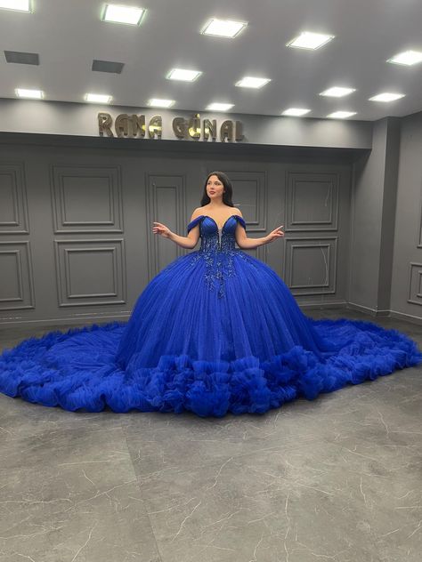 **Royal Sapphire: Majestic Blue Quinceañera Dress** Make your Quinceañera celebration a regal affair with this breathtaking sapphire blue gown. Designed for the young woman who wants to make a lasting impression, this dress combines classic Quinceañera elegance with a strikingly bold color that will leave everyone in awe. **Features - **Stunning Silhouette This full ball gown features layers of shimmering tulle that create a voluminous, flowing skirt, making you the center of attention as you gl Quinceanera Dresses Royal Blue, Blue Bridal Gown, Royal Blue Ball Gown, Blue Quinceanera Dress, Royal Blue Quinceanera Dresses, Blue Quinceanera Dresses, Royal Blue Quinceanera, Blue Quinceanera, Quinceañera Dresses