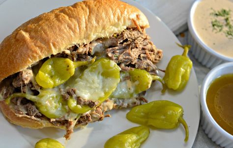 Slow Cooker Italian Beef Sandwich recipe with slow cooked, tender beef, delicious golden Mezzetta peperoncini, and soft bread. Chicago Italian Beef Recipe Crock Pot, Chicago Italian Beef Recipe, Italian Beef Roast, Italian Beef Recipe, Roast Mississippi, Chicago Italian Beef, Italian Beef Sandwich, Mississippi Roast Recipe, Italian Beef Recipes