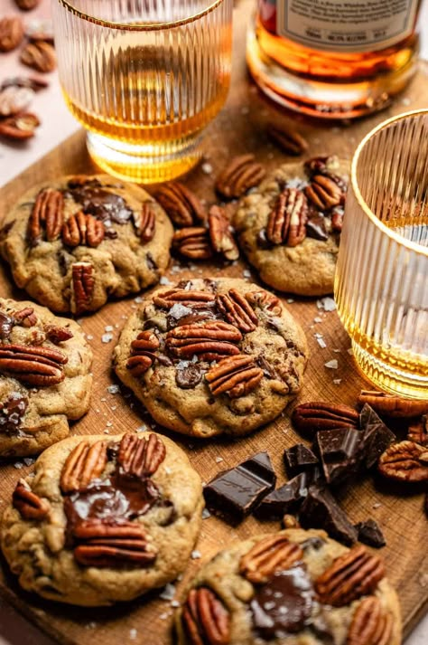 These easy, soft, and gooey bourbon pecan chocolate chip cookies start with bourbon-soaked pecans and are mixed with loads of chocolate chips and the perfect cookie dough! If you love bourbon and chocolate, these are the PERFECT cookies for you! Chocolate Bourbon Cookies, Jesse James Decker Chocolate Chip Cookie, Browned Butter Bourbon Cookies, Baking With Bourbon, Maple Bourbon Cookies, Bourbon Pecan Chocolate Chip Cookies, Bourbon Chocolate Chip Cookies, Brown Butter Bourbon Pecan Cookies, Bourbon Treats