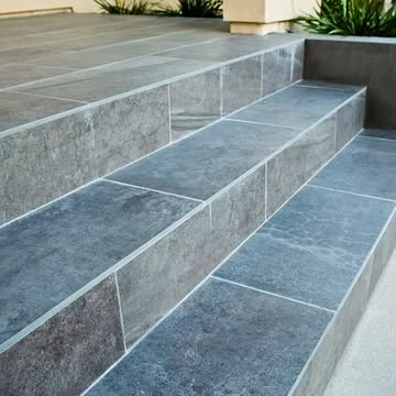 Tile Porch Steps, Tiling Front Door Steps, Front Steps Tile Ideas, Outdoor Porch Tiles Front Steps, Front Door Tile Entryway Exterior, Tile Front Steps, Tiled Steps Indoor, Tiles For Porch Floor, Tile Stairs Outdoor Front Steps