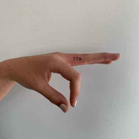 Number Finger Tattoo. A simple number tattoo inked in a neat font. Click through for 30 finger tattoo ideas. #fingertattoos #tattooideas #tattoos #numbertattoo IG: @jongutattoo Number Finger Tattoo, Flower Finger Tattoos, 27 Tattoo, Cool Finger Tattoos, Finger Tattoo For Women, Finger Tats, Hand And Finger Tattoos, Number Tattoos, Finger Tattoo Designs