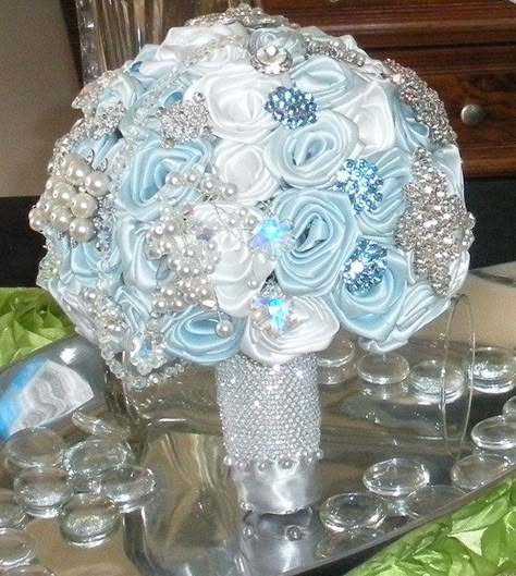 Light Blue Bouquet Quinceanera, Ice Blue Party Decorations, Ice Blue Bouquet, Quince Flower Bouquets Blue, Winter Wonderland Bouquet, Ice Blue Quinceanera Dresses, Quinceanera Bouquet Blue, Quince Bouquet Blue, Ice Theme Wedding