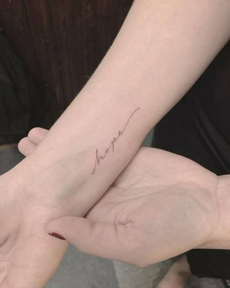 Single Needle Tattoos | Tattoofilter Hope Tattoo On Wrist, The Word Hope Tattoo, Pretty Cursive Tattoos, Tattoo Words On Wrist, Fine Line Wrist Tattoo Words, Pretty Writing Tattoos, Words Tattoo Wrist, Hope Cursive Tattoo, Peace Cursive Tattoo