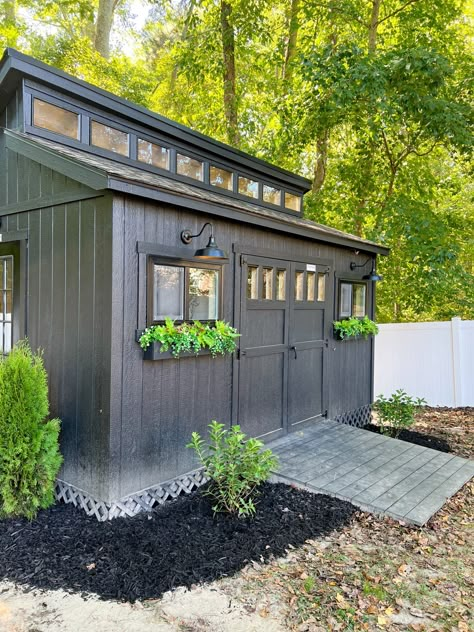 Small Workshop Shed Ideas, Shrubs Around Shed, Shed With Planter Boxes, Tin Shed Makeover Exterior, Black Outdoor Shed, Shed Addition To House, Outdoor Buildings Storage Sheds, She Shed Workshop Ideas, Multipurpose Shed Ideas