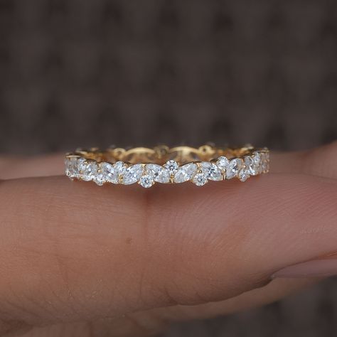 Delicate Marquise and Round Moissanite / Lab Grown Diamond Wedding Band, 14K Gold Full Eternity Band, Diamond Stacking Ring Anniversary Band ● 𝐃𝐢𝐚𝐦𝐨𝐧𝐝 𝐃𝐞𝐭𝐚𝐢𝐥𝐬: ➢ Shape: Marquise Cut and Round Cut ➢ Diamond Type: Lab Grown Diamond ( EF - VS) / Moissanite ( DE - VVS) ➢ Carat:  0.8 TCW apx 𝐑𝐢𝐧𝐠 𝐃𝐞𝐭𝐚𝐢𝐥𝐬: ➢ Shank Width : 2.3 MM ➢ Shank Thickness : 1.8 MM 𝐀𝐥𝐥 𝐥𝐢𝐬𝐭𝐞𝐝 𝐫𝐢𝐧𝐠 𝐚𝐫𝐞 𝐦𝐚𝐝𝐞 𝐚𝐬 𝐚 𝐜𝐮𝐬𝐭𝐨𝐦 𝐨𝐫𝐝𝐞𝐫, 𝐚𝐧𝐝 𝐡𝐞𝐧𝐜𝐞, 𝐭𝐡𝐞 𝐦𝐞𝐚𝐬𝐮𝐫𝐞𝐦𝐞𝐧𝐭𝐬 𝐨𝐫 𝐜𝐚𝐫𝐚𝐭 𝐰𝐞𝐢𝐠𝐡𝐭 𝐜𝐚𝐧 𝐝𝐢𝐟𝐟𝐞𝐫 𝐬𝐥𝐢𝐠𝐡𝐭𝐥𝐲 𝐝𝐞𝐩𝐞𝐧𝐝𝐢𝐧𝐠 𝐨𝐧 𝐭𝐡𝐞 𝐚𝐯𝐚𝐢𝐥𝐚𝐛𝐢𝐥𝐢𝐭𝐲 𝐨𝐟 𝐝𝐢𝐚𝐦𝐨𝐧𝐝𝐬. 𝐅𝐨𝐫 𝐦𝐨𝐫𝐞 𝐝𝐞𝐭𝐚𝐢𝐥𝐬, 𝐟𝐞𝐞𝐥 𝐟𝐫𝐞𝐞 𝐭𝐨 𝐜𝐨𝐧𝐭𝐚𝐜𝐭 𝐮𝐬. ● 𝐂𝐞𝐫𝐭𝐢𝐟𝐢𝐜𝐚𝐭𝐢𝐨𝐧 We do provide Jewelry Certificate on request Eternity Ring Diamond Marquise, 7 Diamond Wedding Band, Mixed Stone Wedding Band, Eternity Ring Diamond Stack, Eternity Ring Stack, Wedding Ring And Band, Marquise Eternity Band, Pave Wedding Bands, Stacked Rings