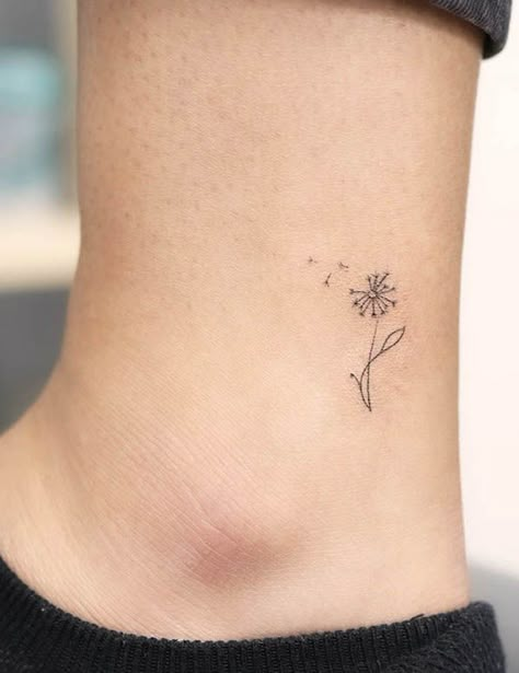 Wish Tattoo Symbols, Fineline Tattoo Behind Ear, Tiny Dandelion Tattoo Wrist, Dandelion Tattoo With Name, Pictures Of Dandelions, Dandelion Tattoo On Finger, Small White Ink Tattoo For Women, Sunflower Dandelion Tattoo, Tiny Tattoos Dandelion