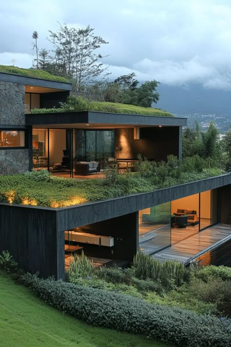 Modern green exterior house with earth roof. Check out all of these green exterior houses that offer a mix of creative and eco-friendly designs. Gazebo House Design, Stone House Designs Exterior, Eco Friendly Modern House, Green Design Architecture, Green Roofs On Houses, Creative House Exterior, Green Roofs Architecture, Retro Futurism House Exterior, Modern House Extension