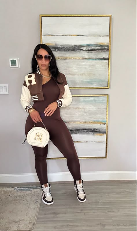 Black Jumpsuit Sneakers Outfit, Backwards Hat Outfit Women, Brown Bodysuit Outfit Black Women, Jumpsuit Concert Outfit, Black Jumpsuit Outfit Black Women, Brown Romper Outfit, Jumpsuit And Sneakers Outfit, Cute Basketball Game Outfit, Catsuit Outfit Jumpsuits