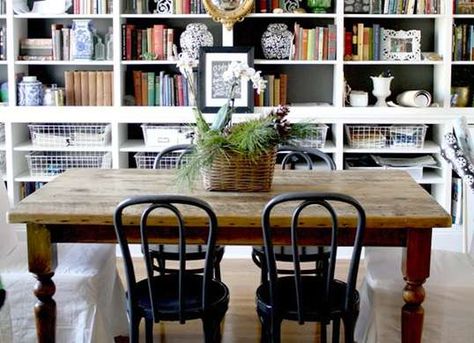 This library-dining room combo is a smart and attractive way to get double the use out of your dining room. Living And Dining Small Space, Dual Purpose Dining Room Office, Dining Room Library Ideas, Dining Room Libraries, Extra Small Dining Room Ideas, Bookcases In Dining Room, Dining Room Study Combo, Multiuse Dining Room, Dining Room Library Combo Ideas