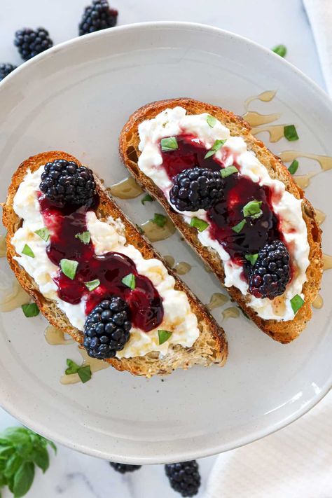 This incredibly delicious and easy recipe features toasted bread covered in creamy burrata cheese and blackberry jam! Top everything off with a drizzle of honey and some fresh basil leaves. Recipe Using Sourdough Bread, Eggless Breakfast Ideas, Jam Aesthetic, Burrata Toast, Peanut Butter Oatmeal Balls, Eggless Breakfast, Burrata Recipe, Fruit And Yogurt Parfait, Jam Toast