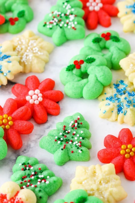 These Spritz Cookies are buttery, tender and such festive Christmas cookies! The cookie dough is super easy to put together and there's so many ways to decorate them. A great make-ahead cookie! Christmas Cookie Easy, Best Spritz Cookie Recipe, Buttery Spritz Cookies, December Baking, Cabin Meals, Christmas Spritz Cookies, Festive Christmas Cookies, Spritz Cookie, Best Gingerbread Cookies