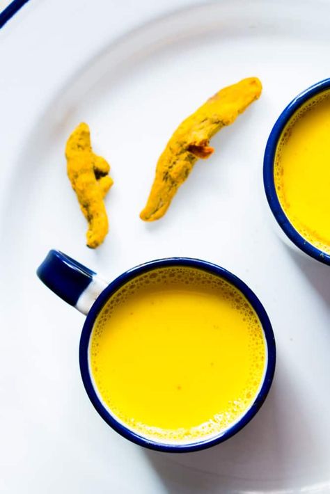 Golden Turmeric Milk or Haldi Doodh is a powerful Ayurvedic Indian drink with medicinal properties. We've been making it for generations and it's so important to make it the right way! It's a great immunity booster when suffering from cold, cough, sore throat, headaches, joint aches etc. It's best when made with milk, but you can use any plant based milk to make it vegan. Golden Turmeric Milk, Haldi Doodh, For Sore Throat, Indian Drinks, Chia Seed Recipes Pudding, Turmeric Milk, Turmeric Recipes, Poor Digestion, Turmeric Tea