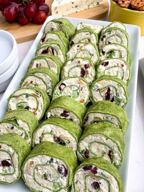 are filled with chicken, almonds, cranberries, green onions, and feta, rolled up in spinach tortillas. A great appetizer for parties -- and they taste even better than they look. As an Amazon Associate I earn from qualifying purchases. You Tortilla Pinwheel Appetizers, Chicken Cranberry Salad, Pinwheel Sandwich Recipes, Tortilla Pinwheels Recipe, Spinach Tortillas, Chicken Cranberry, St Patricks Food, Chicken Pinwheels, Cream Cheese Pinwheels