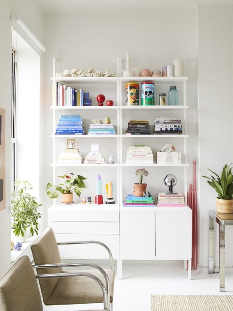 This Designer’s Rental Renovation Is All Good Vibes and Budget DIYs Studio Apartment With Kitchen, Living Room Plant Decor, Room Plant Decor, White Painted Floors, Rental Renovation, Sitting Ideas, White Shelving, White Shelving Unit, Living Room Makeover Ideas