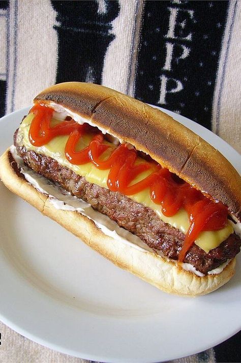 All-American Burger Dog | "Great recipe for a classic burger that just happens to be shaped like a hot dog!" #grilling #grillingrecipes #grillingideas Cheeseburger Hot Dogs, Burger Dogs Recipes, Bacon Burger Dog, Hot Dog Burger, Hot Dog Quesadilla, Leftover Hot Dog Buns, Toasted Hot Dog Buns, Burger Dog, Burger Hot Dog