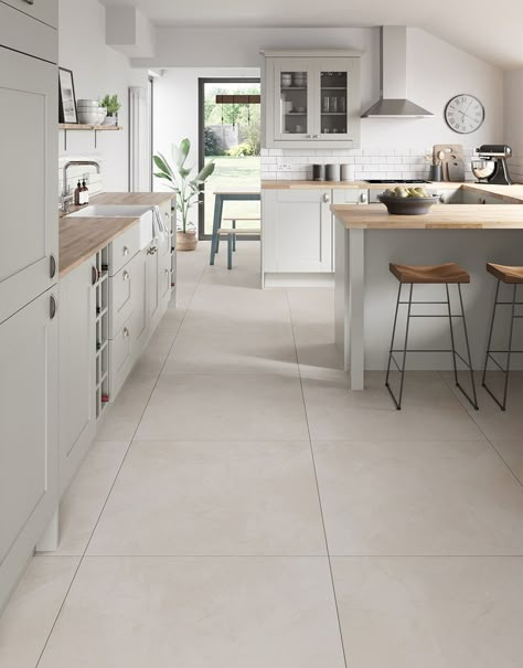 Introducing our exquisite Capri Travertine Stone porcelain floor tiles, a perfect blend of sophistication and durability for your home. Crafted with meticulous attention to detail, these tiles add a touch of class to any room and create a seamless and expansive look for your home. Resistant to stains, scratches, and wear, these tiles offer both style and practicality, making them an ideal choice for high-traffic areas. Elevate your home with the versatility and charm of these premium porcelain floor tiles.  Capri Travertine Stone boasting a soft, neutral hue that effortlessly complements various design aesthetics and seamlessly blends sophistication with durability.     Available in 60cm x 60cm and 80cm x 80cm tile sizes. Neutral Tile Floor Living Room, Open Plan Tiled Floor, Kitchen Floor Tile Design Ideas, Japandi Kitchen Floor Tiles, Cream Kitchen Floor Tiles, Kitchen With Stone Floor, Kitchen White Tile Floor, Floor White Tiles, Different Flooring In Different Rooms