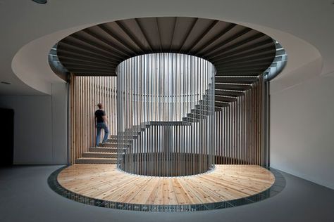 A very unique styled stair case ! Love the way each column is placed to draw your attention in a circular motion towards the top of the stair case .: Circle Stairs Design, Unique Stairs, Circular Architecture, Circular Staircase, Stairs Design Circular, Modern Circular Staircase, Circular Stairs Curved Staircase, Stairs Spiral Modern, سلالم حلزونية