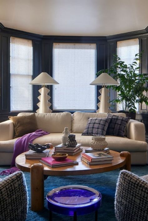 As seen in @luxemagazine, "@studiovandenakker armchairs upholstered in a cozy @dedarmilano bouclé and a vintage coffee table provide a striking contrast to the living room’s traditional millwork. Contemporary photography by @zoe_leonard_studio, @gordonparksfoundation, @mingsmithphoto, and @egglestonartfoundation adorn the walls."⁠ Traditional Millwork, Green Lamp, Vintage Coffee Table, California Living, Oak Panels, Interior Wall Design, Stylish Living Room, Coffee Table Vintage, Contemporary Photography