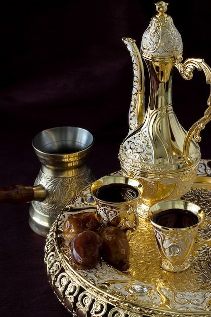 Still life with traditional golden arabi... | Premium Photo #Freepik #photo #ramadan-table #ramadan-dates #ramadan-iftar #suhoor Arabic Tea, Ethiopian Coffee, Muslim Culture, Caffeine Addict, Lebanese Cuisine, Ramadan Kareem Decoration, Arabic Coffee, Orange Blossom Water, Milk Foam