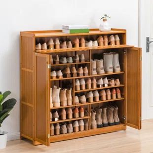 Latitude Run® 24 Pair Shoe Storage Cabinet | Wayfair Shoe Storage Cabinet With Doors, Home Entry Way, Powder Room Redo, Shoe Cabinet Entryway, Boot Organization, Mud Room Entry, Storage Cabinet With Doors, Bifold Door, Bamboo Shoe Rack