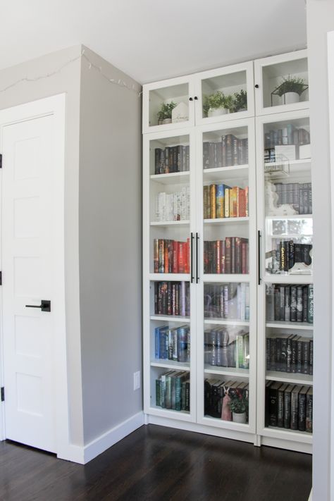 Spring Home Tour Home Office Billy ikea bookcases white built ins white bookcases with glass doors, rainbow book organization Ikea Billy Bookcase With Glass Doors, White Billy Bookcase With Black Doors, Library With Glass Doors, Home Library With Glass Doors, Book Shelf With Glass Door Ideas, Built In Bookshelves With Glass Doors, Book Closet Ideas, Bookshelf Glass Doors, Ikea Billy Bookcase With Doors