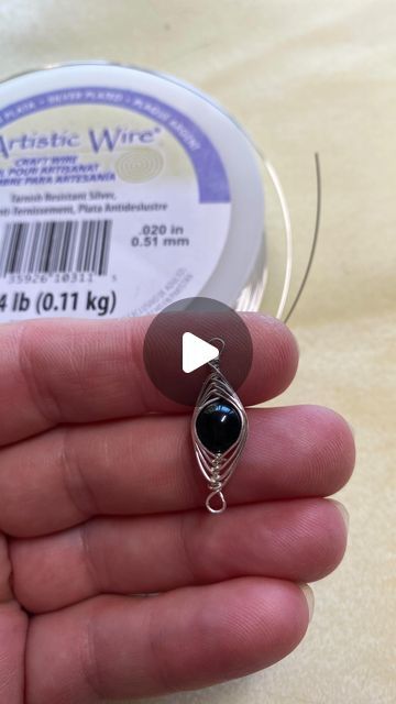 Andria Bieber on Instagram: "How to Create a Herringbone Wire Wrapped Bead @artisticwirebrand  and @beadalon  1. I’m using 24 gauge wire & an 8 mm bead  2. cut 20 inches of wire. You’ll want to adjust the length of the wire according to the size of the bead you’re using. If you’re using a larger bead you’ll need more wire. If you’re doing a smaller bead you’ll need less. For a smaller Bead you may need 26 gauge wire. 3. Using round nose pliers for my loop and leave a 3 inch long tail of wire. 4. Holding the loop with your pliers. Wrap 10 coils underneath the loop. Wrap tightly and close together.Snip off the excess wire & pinch closed. 5. Add Bead. 6. You will need the exact same space of length of wire on each side of the bead. Once you have the same amount of space ( top and bottom of be Round Nose, Making Videos, School Jewelry, Rock Jewelry, Beaded Wraps, Long Tail, Beads And Wire, The Loop, Beaded Rings