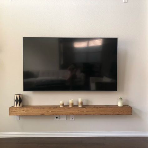 Gracie Oaks Ascension Pine Solid Wood Floating Shelf & Reviews | Wayfair Tv Over Floating Shelf, Tv Wall Beam, Long Shelf Under Tv, Under Tv Wall Mount Shelf, Wood Shelves Under Tv, Wooden Shelf Under Tv On Wall, Wooden Shelf Under Tv, Hanging Tv With Floating Shelves, Tv Floating Shelf Decor