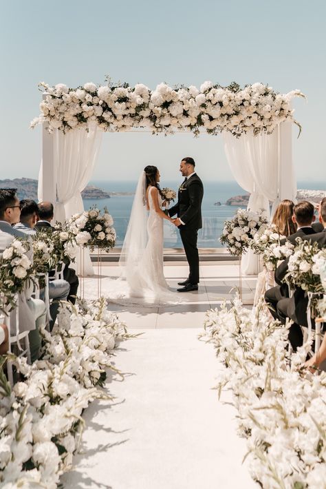 Wedding Aslie, In The Clouds Wedding Theme, Beach Wedding White Theme, Chuppah Beach Wedding, Beach Wedding Neutral Colors, Decorating Arch For Wedding, Beach Wedding Dress 2023, Elegant Beach Wedding Ceremony, Beach Gazebo Wedding