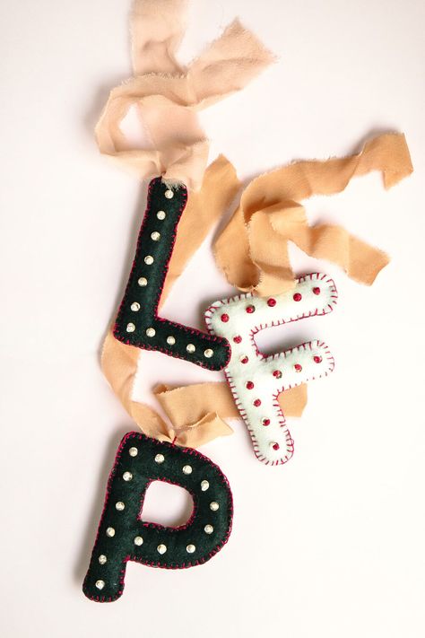 DIY Felt Monogram Ornaments Diy Yarn Letter Ornaments, Felt Monogram Letters, Letters For Stockings Diy Christmas, How To Make Felt Letters Diy, Felt Ornaments Initials, Stocking Letters Diy, Personalized Felt Ornaments, Felt Tree Topper Diy, Felt Ornaments Letter