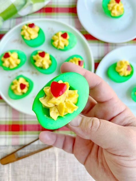 Today, we’re making Grinch Eggs! These are simply deviled eggs with a little holiday magic. We’re going to take some hard boiled eggs, dye them green, fill them with a savory filling kissed with Old Bay, then finish them off with a little red bell pepper heart. Cocoa Dip Recipe, Hard Boiling Eggs, Hot Cocoa Dip, Cocoa Dip, Winter Pasta, Boiling Eggs, Book Themed Party, Grinch Party, Stuffed Mini Peppers