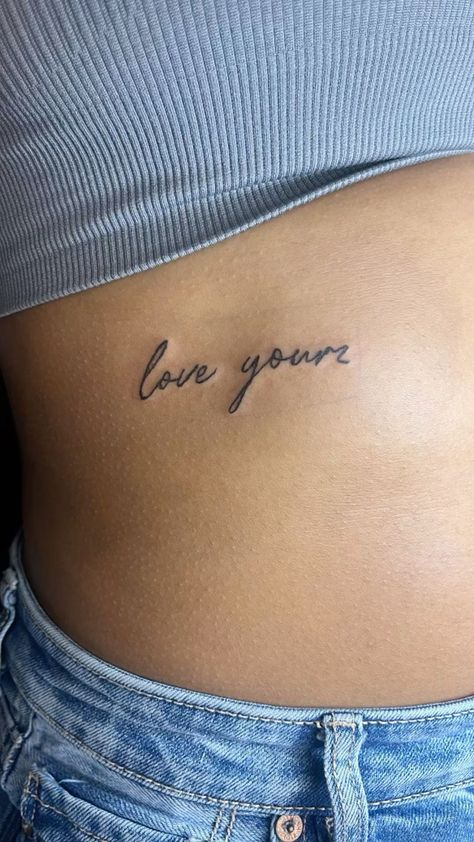 I Love My Wife Tattoo, Simple Rib Cage Tattoos For Women, Tattoo Idea Ribs Women, Rib Cursive Tattoo, Love Yourz Tattoo Red Ink, Love Yourz J Cole Tattoo Cursive Font, Rib Cage Quote Tattoos, Underboob Quote Tattoo, Small Tattoos On Ribs