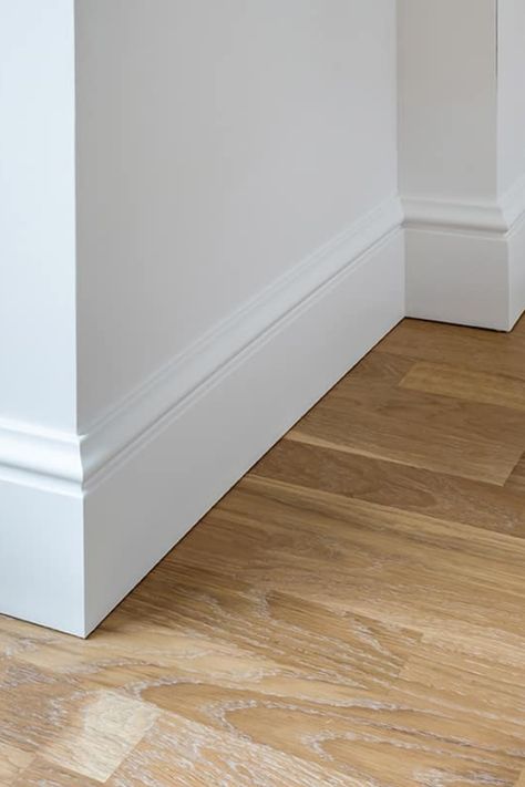 Baseboards are the unsung heroes of home design, offering both protection and a polished look to the walls they adorn. Selecting the right size is essential for the overall harmony of your room's design. Standard baseboard sizes can vary, and choosing the appropriate one can enhance the stature and flow of your space. This guide aims to demystify the standard dimensions of baseboards to help you make the best choice for your home. Types Of Baseboards And Trim, Floor Trim Ideas Baseboards Modern, Cottage Style Baseboards And Trim, White Wall Baseboard Color, Large Baseboard Trim, Classic Baseboards, Studio Mcgee Baseboards, Baseboard Trim Styles Farmhouse, French Country Baseboards And Trim