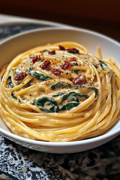 Creamy, dreamy, and bursting with flavor, this Spaghetti & Spinach with Sun-Dried Tomato Cream Sauce is a game-changer! Silky pasta meets a rich tomato cream sauce, balanced by the freshness of spinach for a restaurant-quality meal at home. Whip up something special – get the recipe now #PastaRecipe #EasyDinner #VegetarianMeals #SunDriedTomato #CreamyPasta #QuickDinner #HealthyComfortFood #ItalianInspired #OnePotMeal #WeeknightDinner Spaghetti Sun Dried Tomatoes, Cream Spaghetti Sauce, Spinach Sundried Tomato Pasta, Creamy Sun Dried Tomato Pasta, Spaghetti Spinach, Tomato Cream Sauce Pasta, Vegetable Pasta Recipes, Sun Dried Tomato Pasta, Spaghetti With Spinach