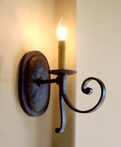 Classic wrought iron sconces make ordinary walls a focal point. Interior Sconces, Mexican Lighting, Wrought Iron Light Fixtures, Lamp Drawing, Wrought Iron Lights, Custom Light Fixtures, Sconces Living Room, Wrought Iron Decor, Wrought Iron Candle