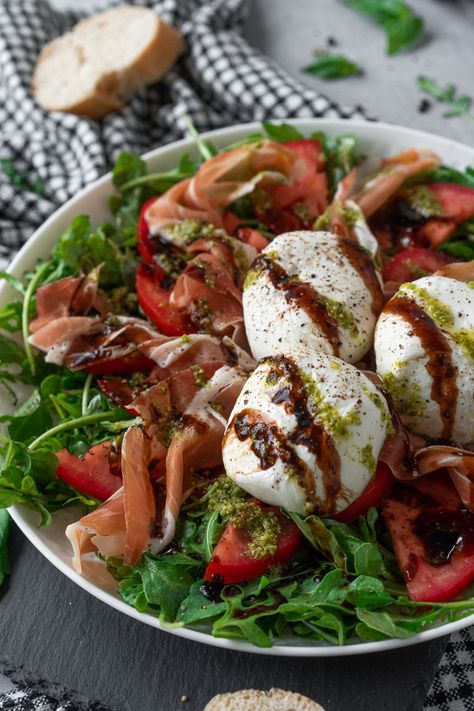 This burrata Caprese salad is a twist on a classic recipe with spicy arugula, savory prosciutto, and a tangy balsamic drizzle. Enjoy it as a shareable starter or light meal. #chelseadishes #capresesalad #burratasalad #prosciuttosalad #appetizersalad Burrata Caprese Salad, Burrata Caprese, Italian Appetizers Easy, Balsamic Drizzle, Dinner Restaurants, Salad Recipes For Dinner, Recipes Appetizers And Snacks, Appetizer Salads, Classic Food