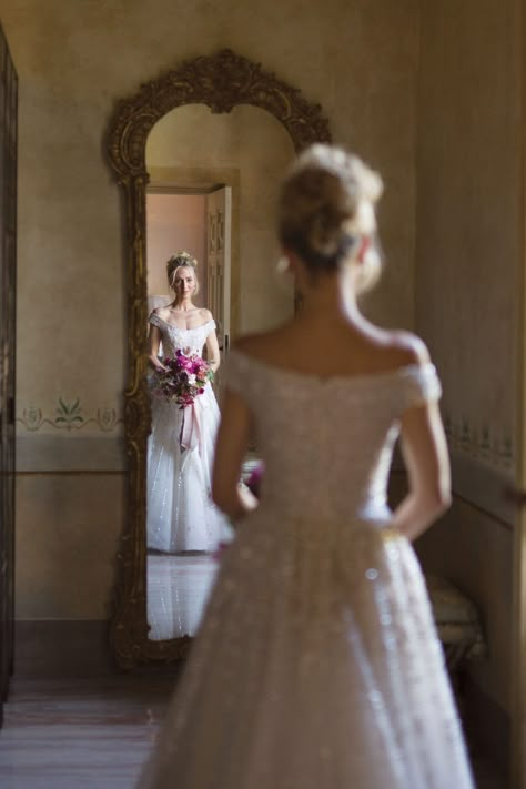 Bride Looking At Dress Photo Ideas, Bride In Mirror Photo, Bride Mirror Photography, Wedding Mirror Picture, Mirror Wedding Photos, Bride Looking In Mirror, Bride Mirror Photo, Regal Wedding Photos, Wedding Photo Mirror