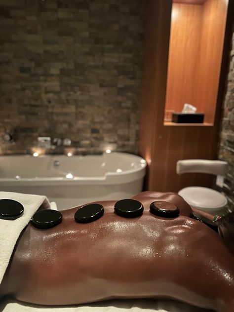 Spa Massage Couple Aesthetic, Hot Stone Massage Diy, Hot Stone Massage Aesthetic, Benefits Of Hot Stone Massage, Limestone Massage Jamaica, Esthetician School, Hot Stone Massage, Hot Stones, Stone Massage