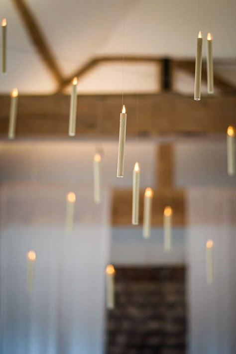 Image shows a Harry Potter themed wedding with hanging candles throughout the ceiling at Farbridge Barns. Photo credit Lucy Davis Photography Floating Candles Wedding Harry Potter, Halloween Decor Hanging From Ceiling, Harry Potter Candle Holder, Candle Hanging From Ceiling, Ceiling Floating Candles, Floating Candle Harry Potter, Hanging Floating Candles, Hanging Candles From Ceiling, Harry Potter Lights From Ceiling