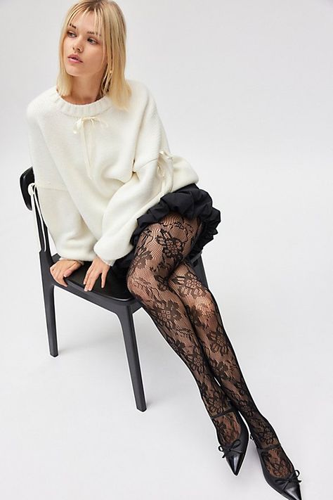 Sheer lace tights with an allover floral pattern for a femme finish. Features Ella lace tights Sheer tights Allover lace pattern Comfy waistband Content + Care 92% Nylon, 8% spandex Hand wash Imported Size + Fit S/M 4'10" -5'6" 90-130lbs L/XL 5'7" -5'6" 130-200lbs | Ella Lace Tights in Black, Women's at Urban Outfitters Nylons And Heels, Sheet Black Tights Outfit, Black Tights With Design, Womens Tights Outfits, Black Lace Tights Outfit, Floral Tights Outfit, Pattern Tights Outfit, Granny Outfit, Lace Tights Outfit