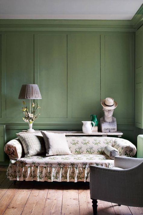 This country-style living room styled by Gabby Deeming has panelled walls painted Farrow & Ball's 'Breakfast Room Green', a soft olive. An antique sofa has been covered with a loose cover in Colefax & Fowler's legendary Bowood chintz. A trestle table displays an interesting collection of antiques including a vintage tole flower lamp and bust of Napoleon. Paint colour ideas | House & Garden Breakfast Room Green, English Country House Style, Country Style Living Room, Style Anglais, Paint Your House, Room Green, English Country Decor, Casa Country, Farrow And Ball Paint