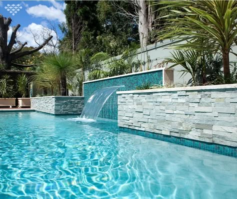 Adding a sheer descent water feature to your pool design not only looks visually stunning, but immediately creates a relaxed atmosphere with the running water sound.  On top of this, lounging on the ledge underneath soon becomes a favourite pasttime for adults and children, alike. Pool Paving, Moderne Pools, Florida Pool, Dream Backyard Pool, Pool Design Ideas, Outside Pool, Stone Pool, Pools Backyard Inground, Pool Water Features