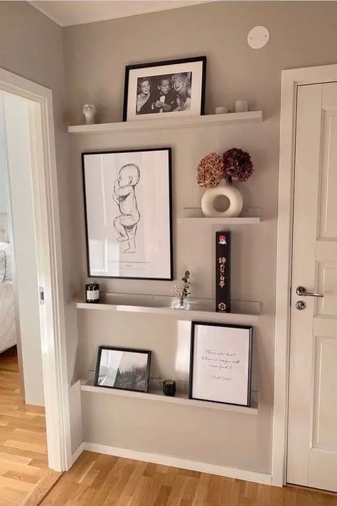 Picture Ledges Staircase, Huge Wall Space Ideas, Picture Ledge Corner, Staggered Picture Shelves, Living Room Wall Ledge Decor, Picture Shelf Entryway, Shelves And Pictures Wall Display, 5 Shelves On Wall Arrangement, Floating Shelf Picture Wall