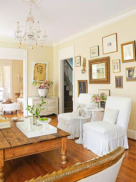 Antique Color Scheme  Tea-Stain + Gold + White. Love the wooden floors and antique gallery wall Pale Yellow Walls, Light Yellow Walls, Yellow Walls Living Room, White Slipcovers, Yellow Paint Colors, Walls Living Room, Yellow Colour Scheme, Yellow Room, Yellow Living Room