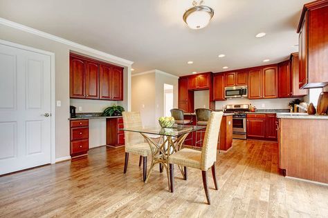 Hardwood Floors With Cherry Cabinets, Wood Floor With Cherry Cabinets, Flooring With Cherry Kitchen Cabinets, Red Cherry Cabinets Kitchen, Luxury Vinyl Plank Flooring Kitchen With Cherry Cabinets, Wood Floors With Cherry Cabinets, Cherry Kitchen Cabinets With Wood Floors, Kitchen Cabinets With Oak Floors, Flooring With Cherry Cabinets