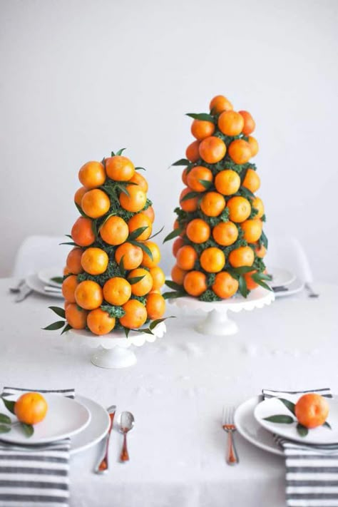 One of the great solaces we have for midwestern winters is the arrival of citrus season! It’s finally... #christmascenterpiecesdiy Citrus Baby, Table Centerpieces Diy, Orange Baby Shower, Decorações Com Comidas, Orange Party, Holiday Tablescapes, A Beautiful Mess, Orange Baby, Holiday Centerpieces